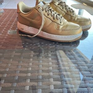 Gold Nike Air Force ones